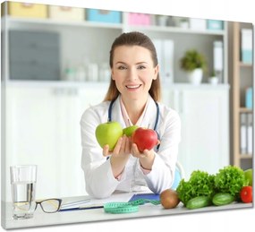 Vászonkép 50x40 Dietetikus hölgy almával
