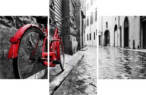 Egy vörös kerék képe egy macskaköves utcán (90x60 cm)