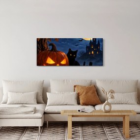 Kép - Fekete macska egy világító halloweeni tök mellett (120x50 cm)