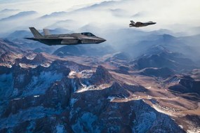 Fotográfia Fighter Jets flying over mountains at dusk, guvendemir