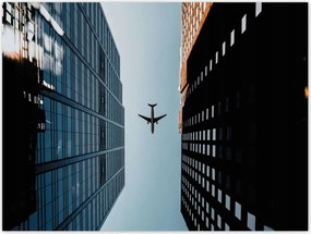 Poszterek 40x30 Repülőgép az épületek között