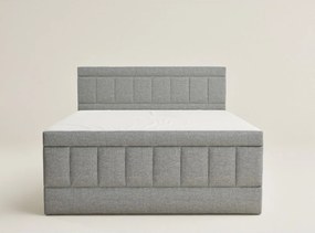 Szürke ágyneműtartós boxspring ágy 180x200 cm Caya – Maison de Rêve