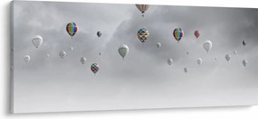 Kép - léggömbök egy téglafal felett (120x50 cm)
