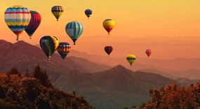 Fotográfia Hot air balloon above high mountain at sunset, AppleZoomZoom