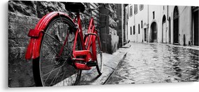 Egy vörös kerék képe egy macskaköves utcán (120x50 cm)