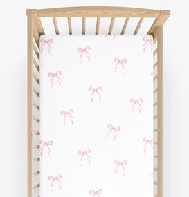 Goldea gyermek gumis pamut lepedő kiságyba - rózsaszín masnik 60 x 120 cm