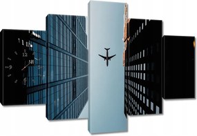 Faliórák 150x105 Repülőgép az épületek között