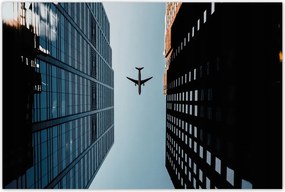 Poszterek 90x60 Repülőgép az épületek között