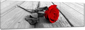 Vászonkép 90x30 Vörös rózsa a deszkákon