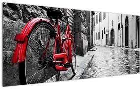Egy vörös kerék képe egy macskaköves utcán (120x50 cm)