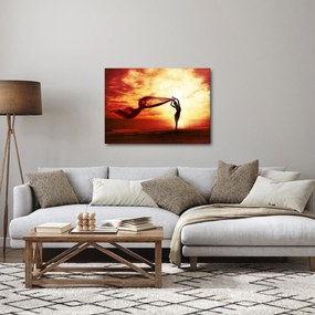 Kép - egy nő sziluettje a naplementében (70x50 cm)