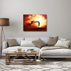 Kép - egy nő sziluettje a naplementében (üvegen) (70x50 cm)