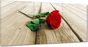 Vászonkép 60x30 Vörös rózsa a deszkákon