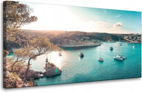Vászonkép Víz a nap tükrében Csónakok Sziklák 80x40 cm