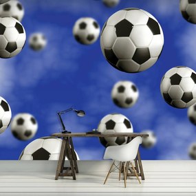 Fotótapéta - Futball-labdák a kék háttérben (152,5x104 cm)