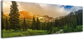 Vászonkép Ösvény a hegyek között Erdő Fák Nap 120x40 cm