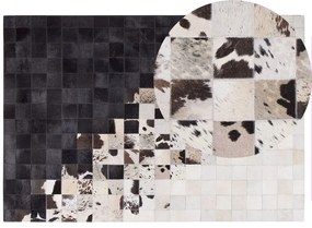 Fekete és fehér bőrszőnyeg 140 x 200 cm KEMAH Beliani