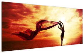 Kép - egy nő sziluettje a naplementében (120x50 cm)