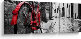 Egy vörös kerék képe egy macskaköves utcán (órával) (90x30 cm)