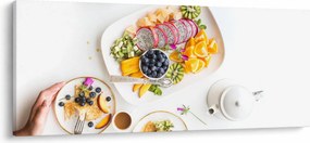 Tányérok gyümölcsökkel az asztalon képe (120x50 cm)