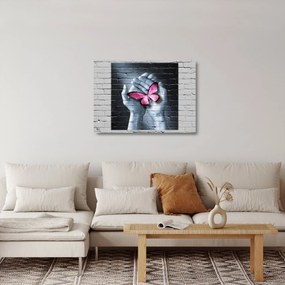 Üveg kép - Rózsaszín pillangó a falon (70x50 cm)