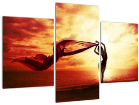 Kép - egy nő sziluettje a naplementében (90x60 cm)