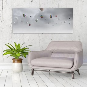 Kép - léggömbök egy téglafal felett (120x50 cm)