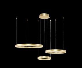 Arany dekoratív lámpa Halo 3 arany térgyűrűk elegáns asztal felett