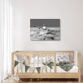 Üveg kép - Repülőgép a felhőkben, fekete-fehér (70x50 cm)