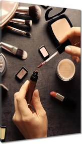 Vászonkép 80x120 Szájfény egy nő kezében