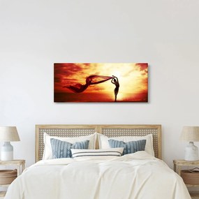 Kép - egy nő sziluettje a naplementében (120x50 cm)