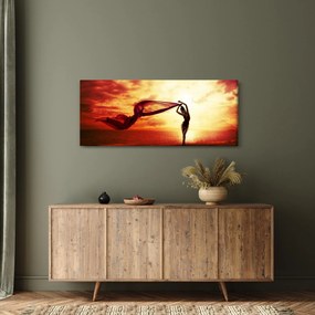 Kép - egy nő sziluettje a naplementében (120x50 cm)