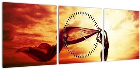 Kép - egy nő sziluettje a naplementében (órával) (90x30 cm)