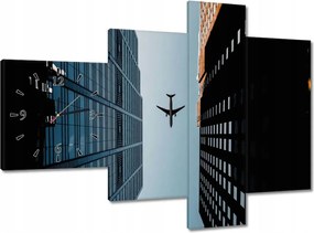 Faliórák 100x70 Repülőgép az épületek között