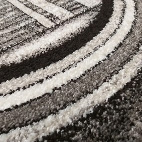 Modern szürke-barna szőnyeg absztrakt körökkel Szélesség: 160 cm | Hossz: 220 cm