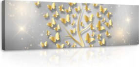 Vászonkép 145x45 Arany pillangók szürke háttérrel a hálószobába elegáns dekoráció