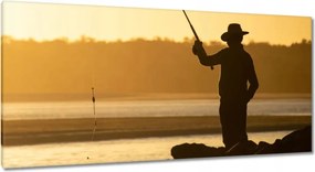 Vászonkép 115x55 Halász a tengeri sziklákon