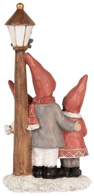 Villanyoszlop alatt éneklő gyerekek karácsonyi dekoráció