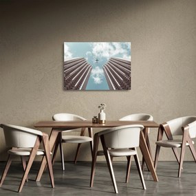 Repülőgép az épületek között képe (üvegen) (70x50 cm)