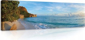 Vászonkép 145x45 Trópusi tengerpart óceán fehér homok kék víz hullámok sziklák